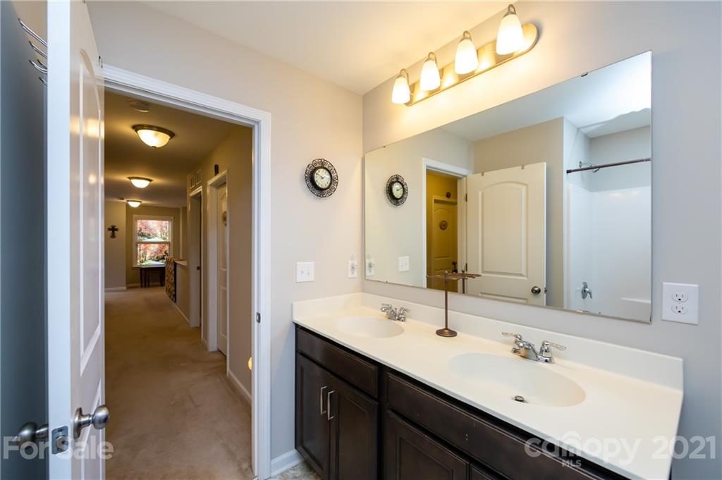 4822 Abendego Road Charlotte, NC 28213 - Photo 39 of 48 a en suite bathroom with a sink double vanity and a mirror