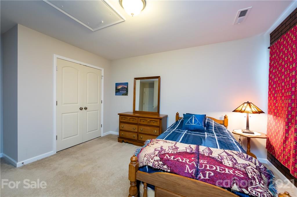 4822 Abendego Road Charlotte, NC 28213 - Photo 43 of 48 a bedroom with a bed and a dresser