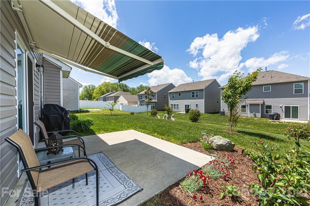 4822 Abendego Road Charlotte, NC 28213 - Photo 47 of 48 a view of house with backyard and outdoor seating