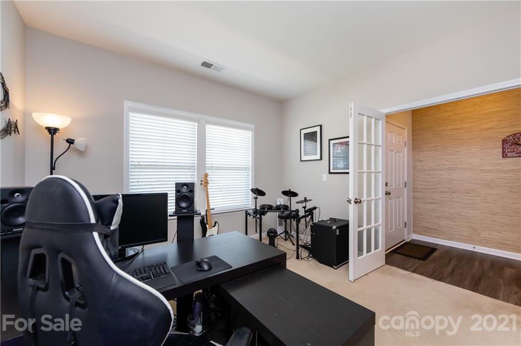 4822 Abendego Road Charlotte, NC 28213 - Photo 6 of 48 a view of a workspace with furniture and a window