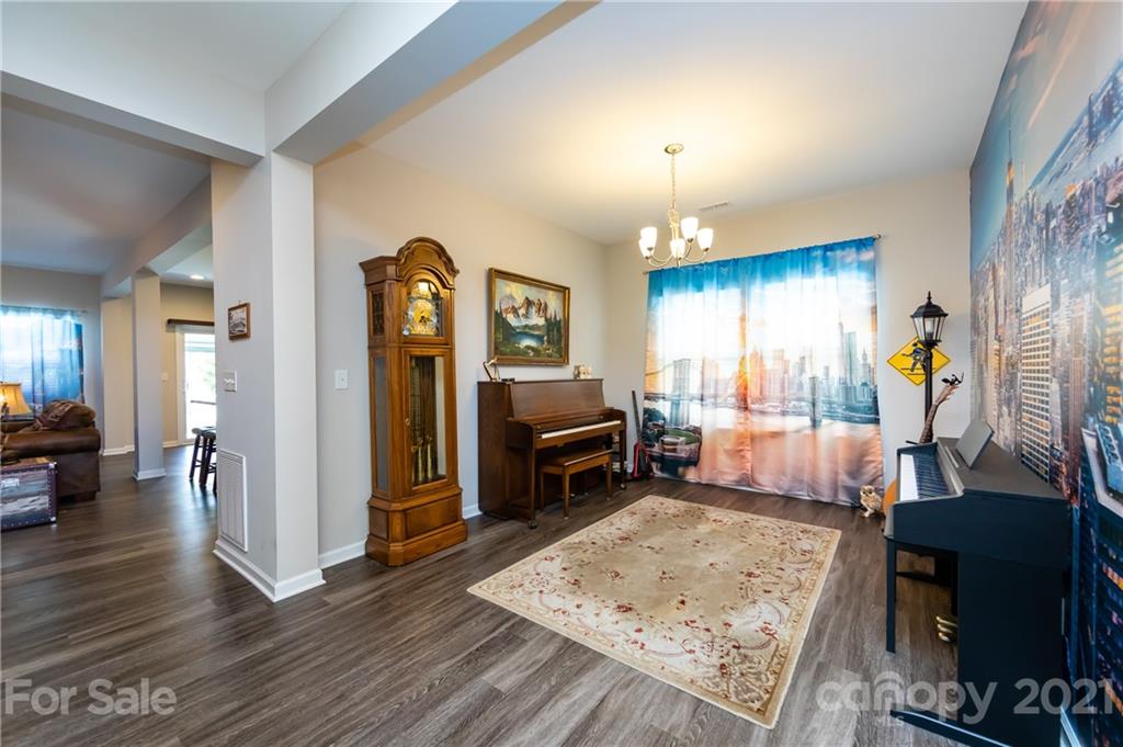 4822 Abendego Road Charlotte, NC 28213 - Photo 8 of 48 a living room with furniture and a wooden floor