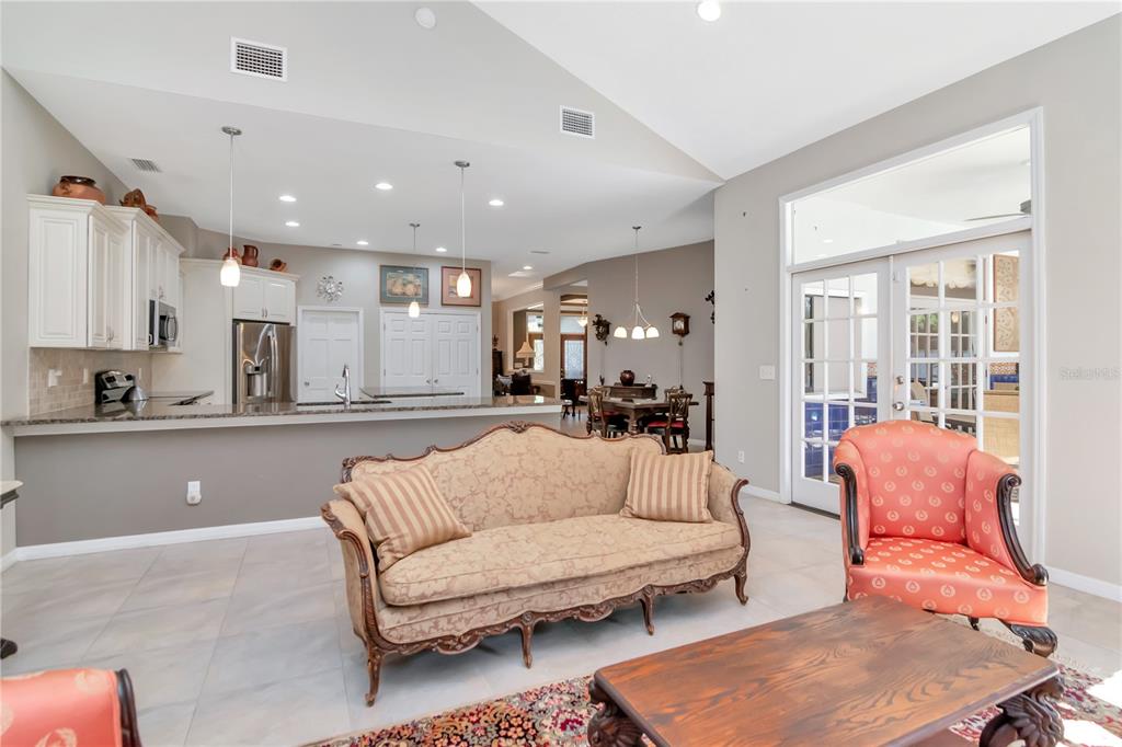 4511 Country Gate Court Valrico, FL 33596 - Photo 16 of 64 a living room with furniture and a large window