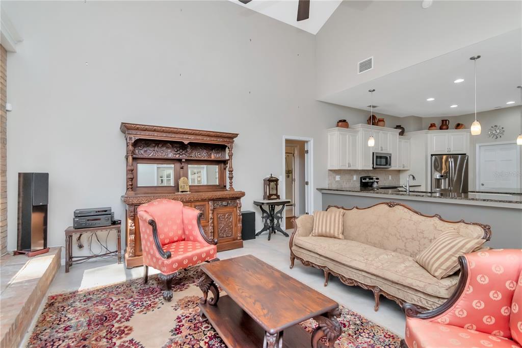 4511 Country Gate Court Valrico, FL 33596 - Photo 17 of 64 a living room with furniture and kitchen view