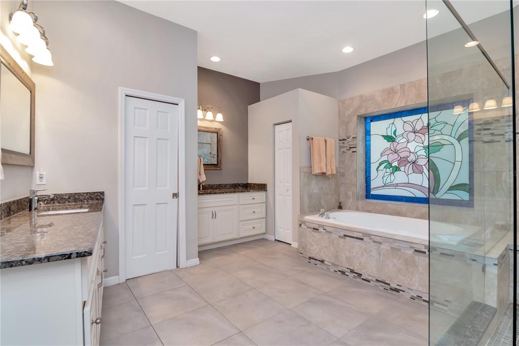 4511 Country Gate Court Valrico, FL 33596 - Photo 21 of 64 a large white kitchen with a stove a refrigerator and a stove top oven