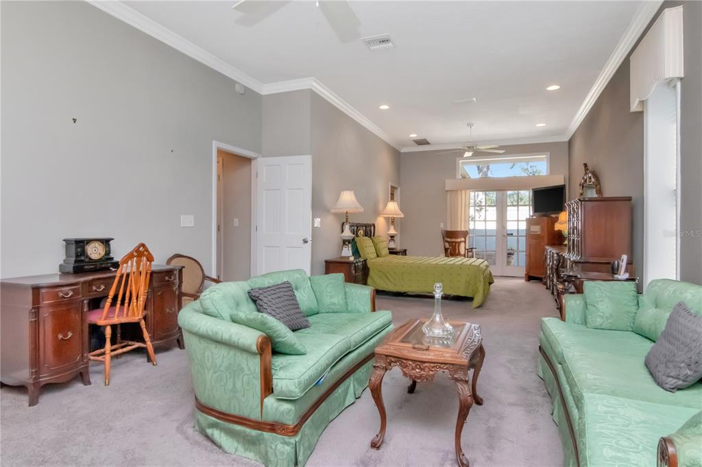 4511 Country Gate Court Valrico, FL 33596 - Photo 25 of 64 a living room with furniture and a lamp