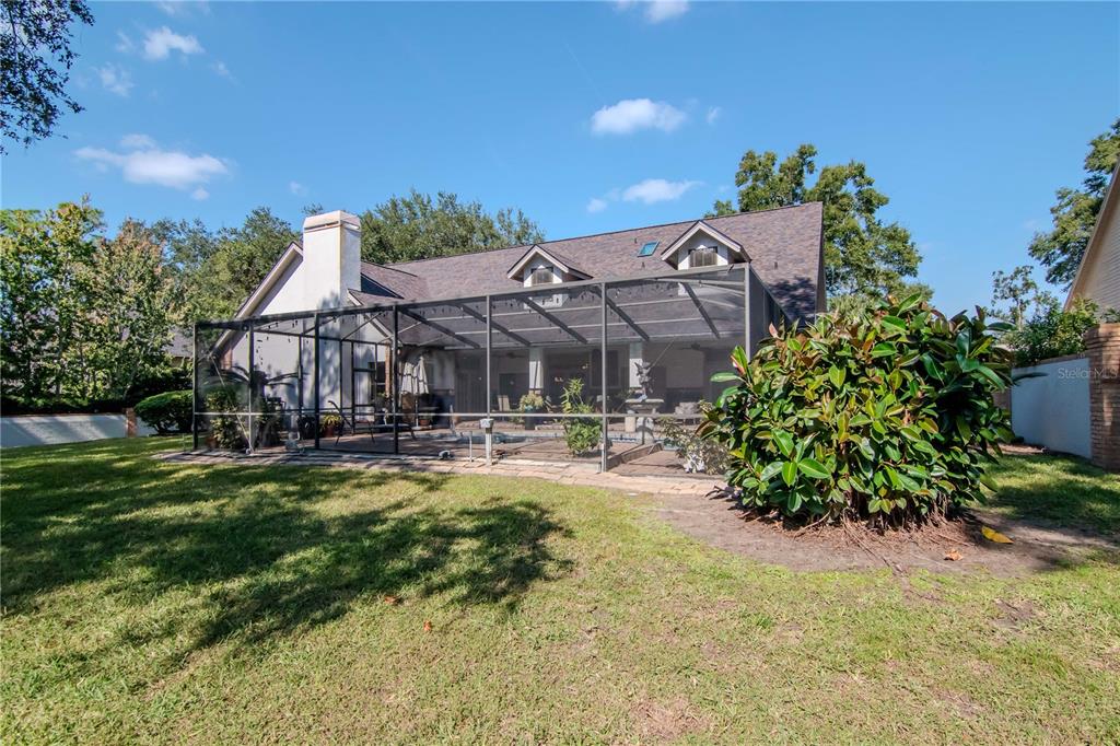 4511 Country Gate Court Valrico, FL 33596 - Photo 32 of 64 a view of a house with swimming pool and sitting area