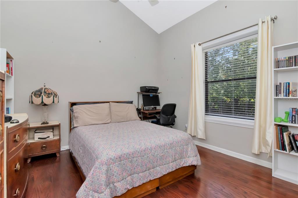 4511 Country Gate Court Valrico, FL 33596 - Photo 33 of 64 a bedroom with a bed and wooden floor