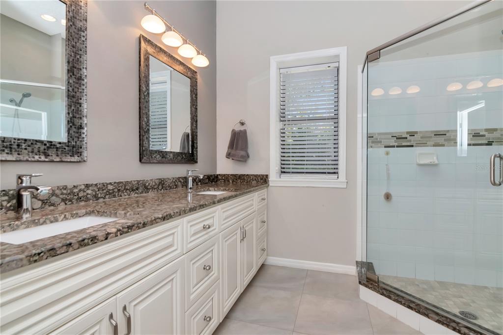 4511 Country Gate Court Valrico, FL 33596 - Photo 34 of 64 a bathroom with a granite countertop sink and a mirror