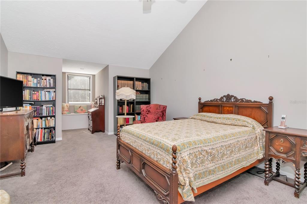 4511 Country Gate Court Valrico, FL 33596 - Photo 39 of 64 a bedroom with a bed and a flat screen tv