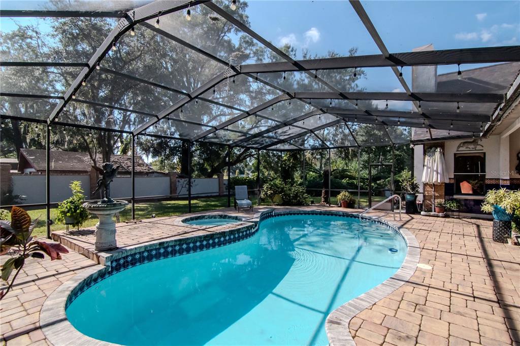 4511 Country Gate Court Valrico, FL 33596 - Photo 52 of 64 a view of a swimming pool with a patio