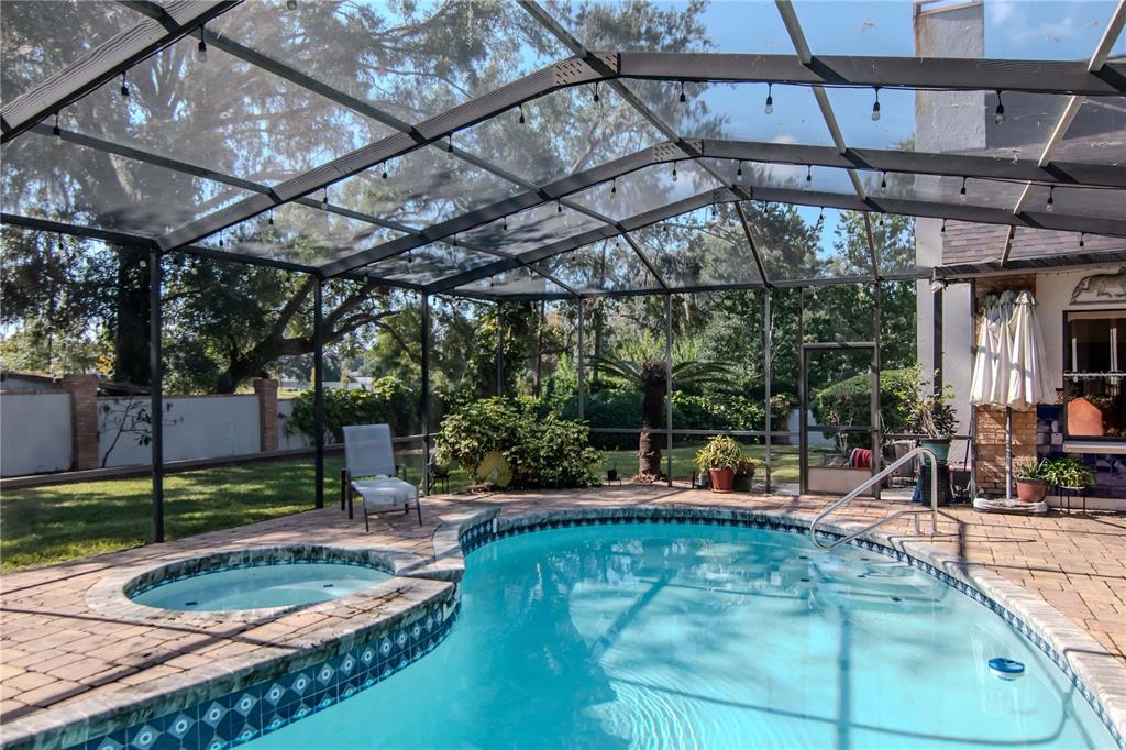 4511 Country Gate Court Valrico, FL 33596 - Photo 53 of 64 a view of a swimming pool with a patio
