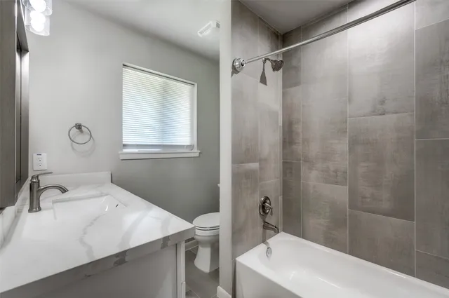 a bathroom with a sink and a bathtub
