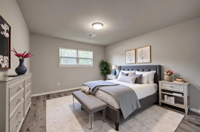 a bedroom with double bed and a window