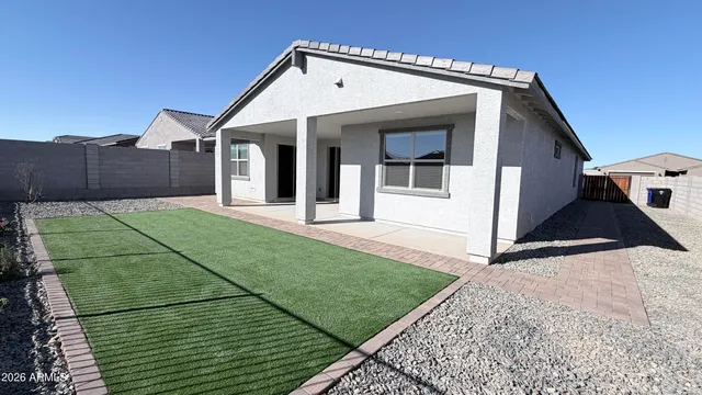 a living room with fireplace furniture and a large window