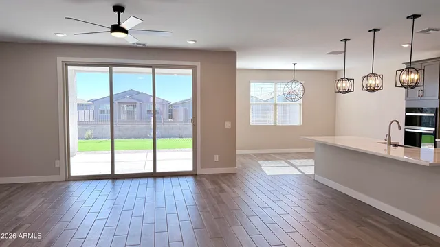 a kitchen with kitchen island white cabinets and stainless steel appliances