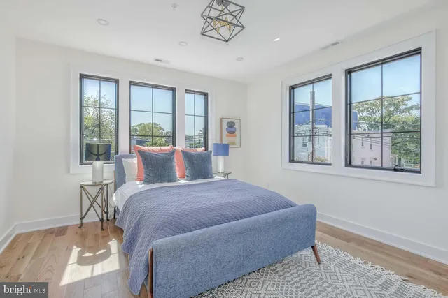 a bedroom with a large bed and a window