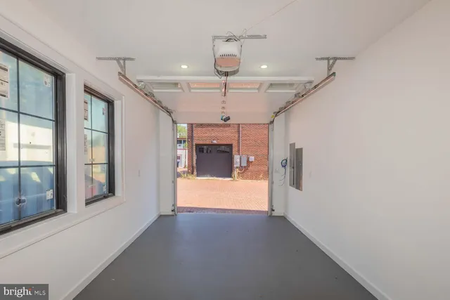 a view of a hallway with a chandelier