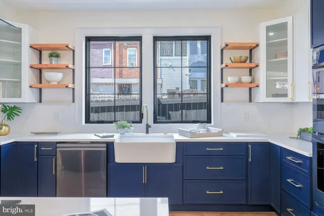 a living room with a sink and a window