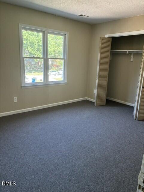 3104 Crandon Lane Raleigh, NC 27604 - Photo 8 of 10 an empty room with closet and windows