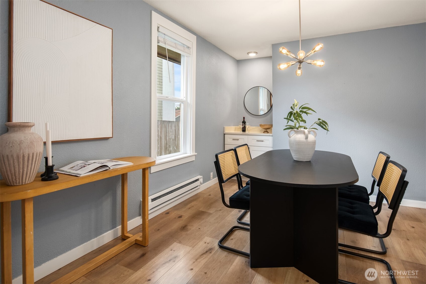 5115 South Roxbury Street Seattle, WA 98118 - Photo 17 of 29 a view of a dining room with furniture and chandelier