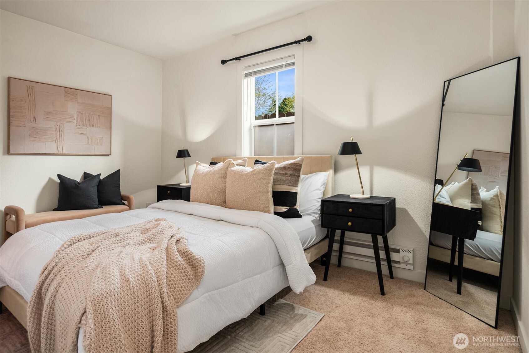 5115 South Roxbury Street Seattle, WA 98118 - Photo 20 of 29 a bedroom with a bed and wooden floor