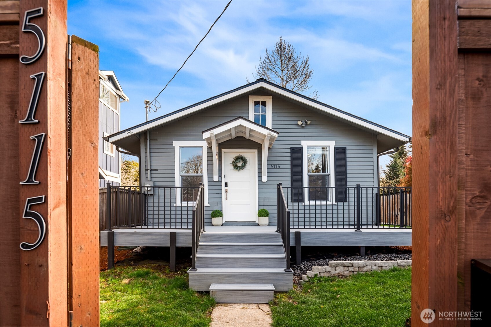 5115 South Roxbury Street Seattle, WA 98118 - Photo 2 of 29 a front view of a house with garden