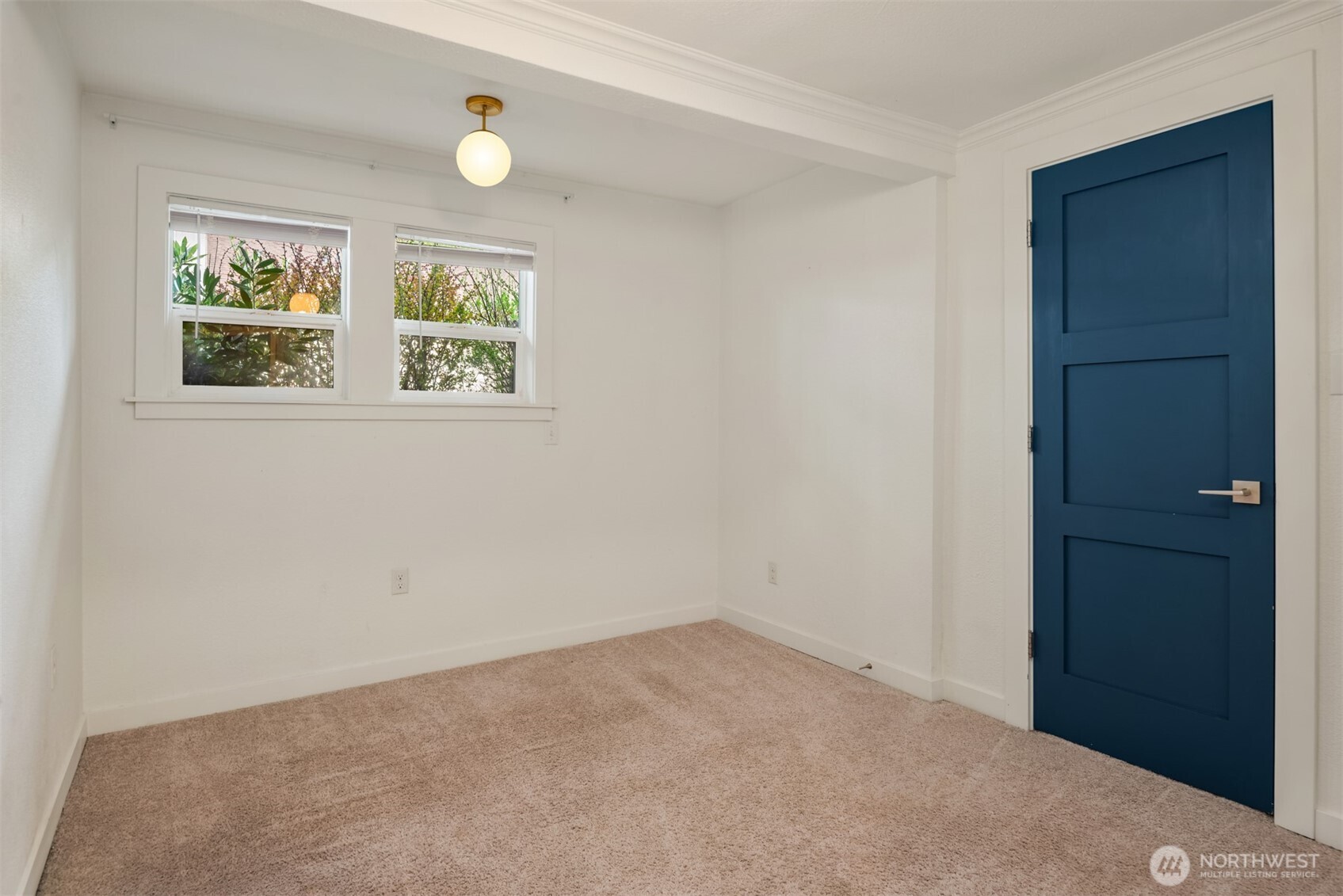 5115 South Roxbury Street Seattle, WA 98118 - Photo 23 of 29 an empty room with windows and closet