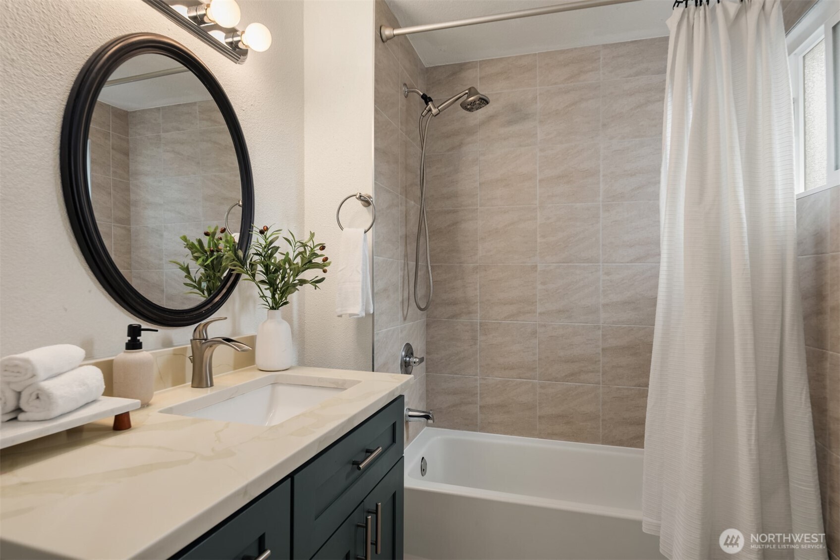 5115 South Roxbury Street Seattle, WA 98118 - Photo 24 of 29 a bathroom with a sink a toilet and a mirror