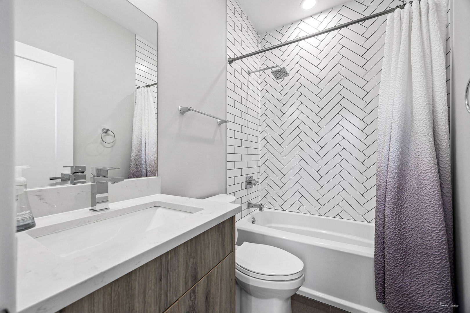 1822 South Throop Street, Unit 2 Chicago, IL 60608 - Photo 15 of 23 a bathroom with a sink and a mirror