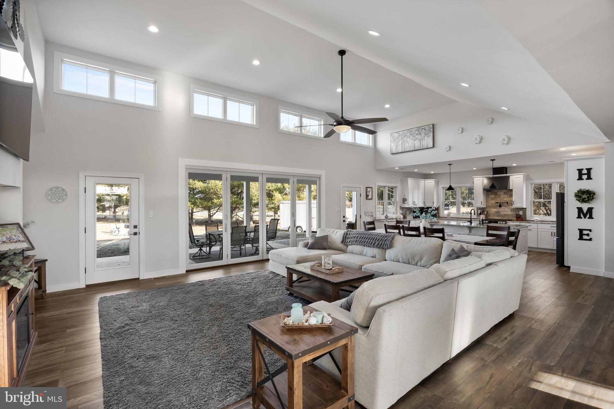 268 Hartford Road Medford, NJ 08055 - Photo 8 of 54 a living room with furniture kitchen area and a wooden floor