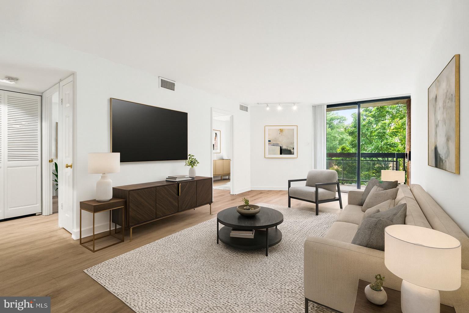 601 24th Street Northwest, Unit 306 Washington, DC 20037 - Photo 1 of 34 a living room with furniture and a flat screen tv