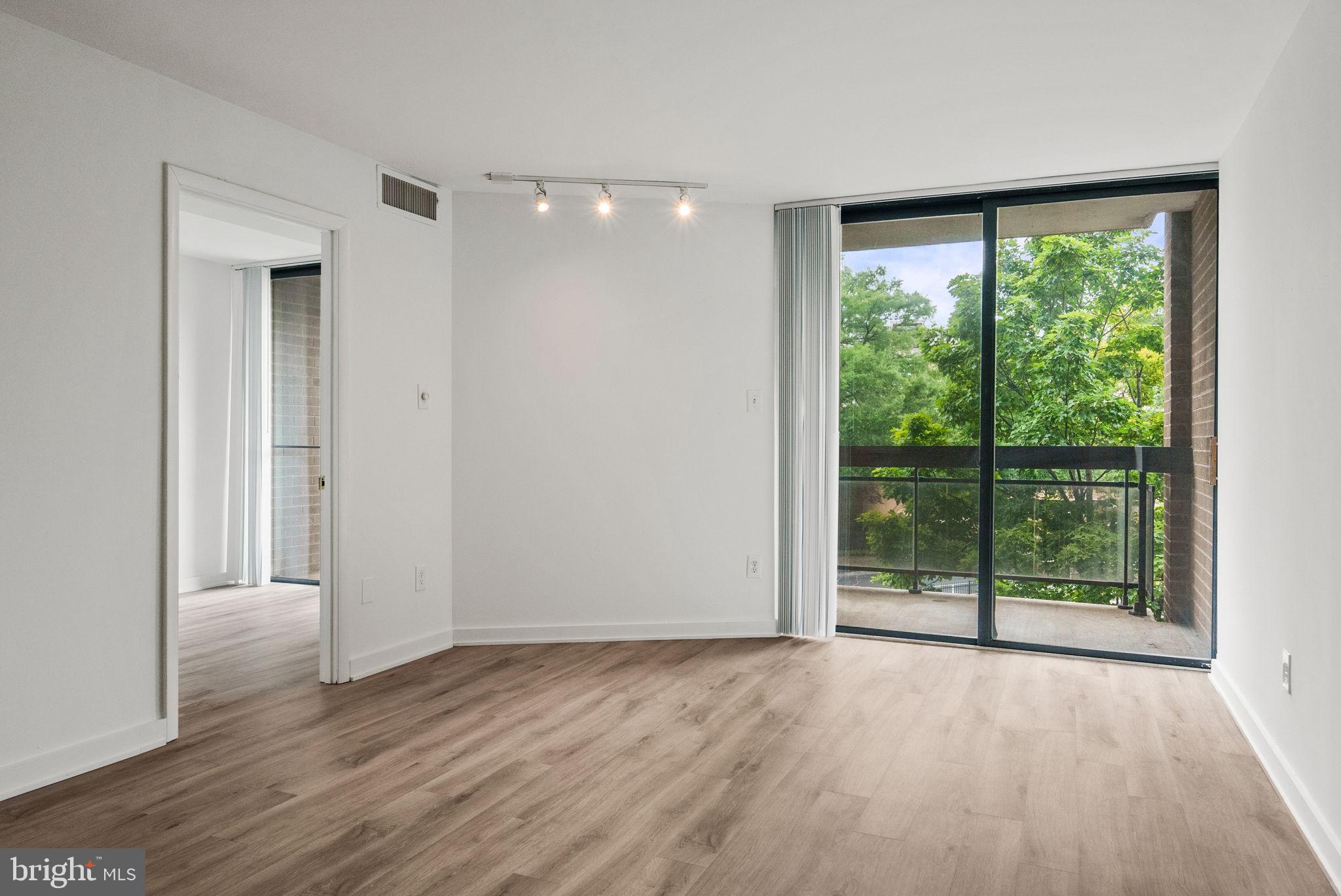601 24th Street Northwest, Unit 306 Washington, DC 20037 - Photo 13 of 34 a view of a room with wooden floor and window