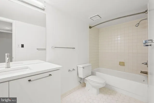 a bathroom with a sink a toilet and a bathtub