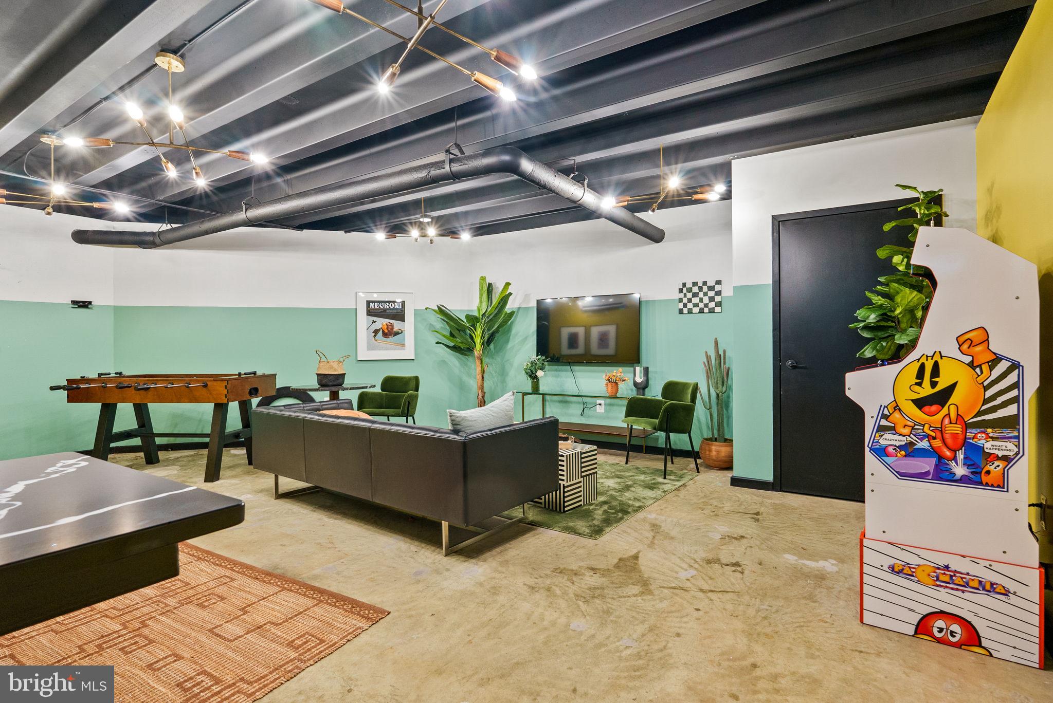 601 24th Street Northwest, Unit 306 Washington, DC 20037 - Photo 30 of 34 a living room with furniture and a chandelier