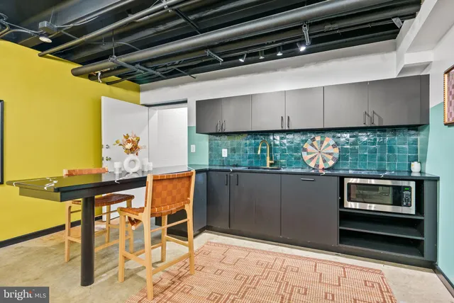 a kitchen with a stove and a microwave