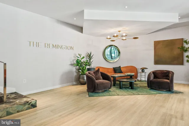 a living room with furniture and a rug