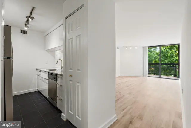 a kitchen with stainless steel appliances a refrigerator and a stove
