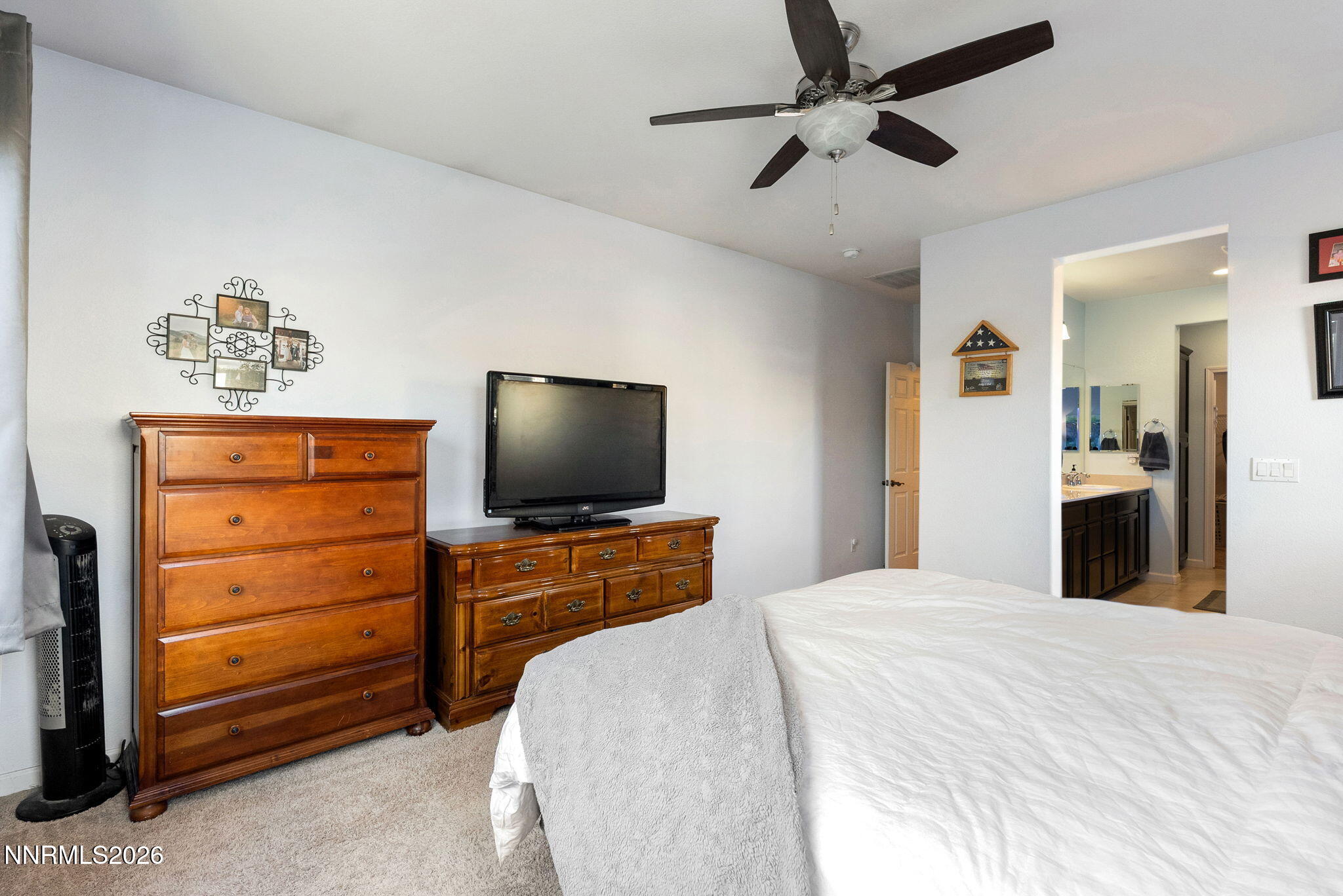 2190 Dutch Draft Drive Reno, NV 89521 - Photo 20 of 32 a bedroom with a bed and a flat screen tv