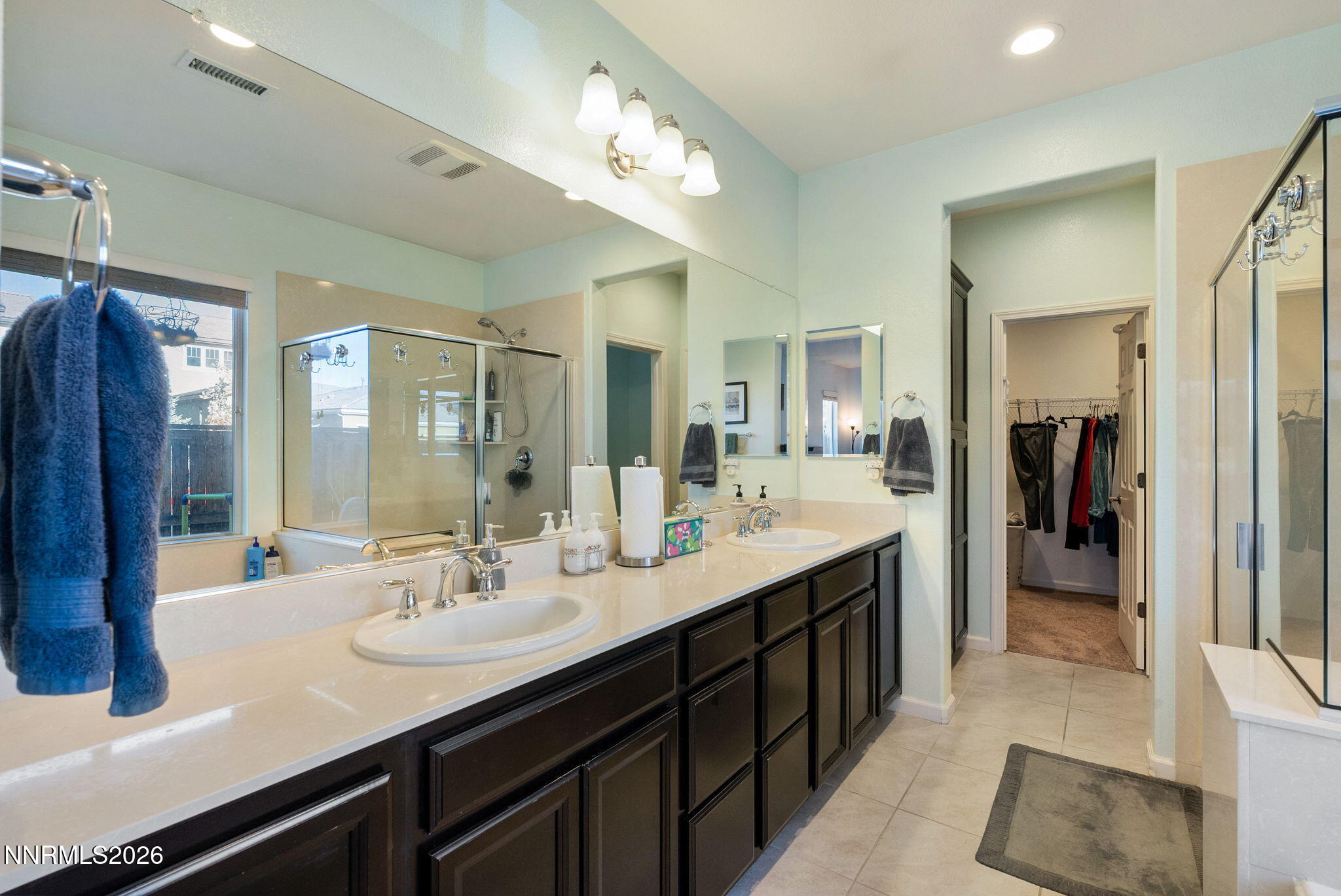 2190 Dutch Draft Drive Reno, NV 89521 - Photo 21 of 32 a en suite bathroom with a double vanity sink and a mirror