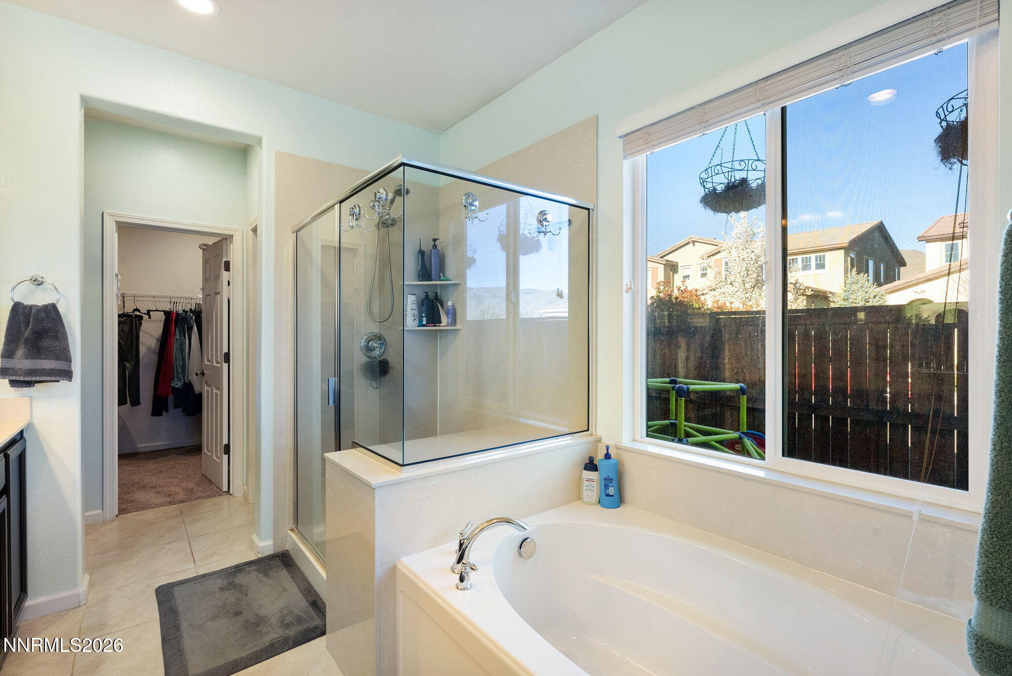 2190 Dutch Draft Drive Reno, NV 89521 - Photo 22 of 32 a bathroom with a tub and a shower
