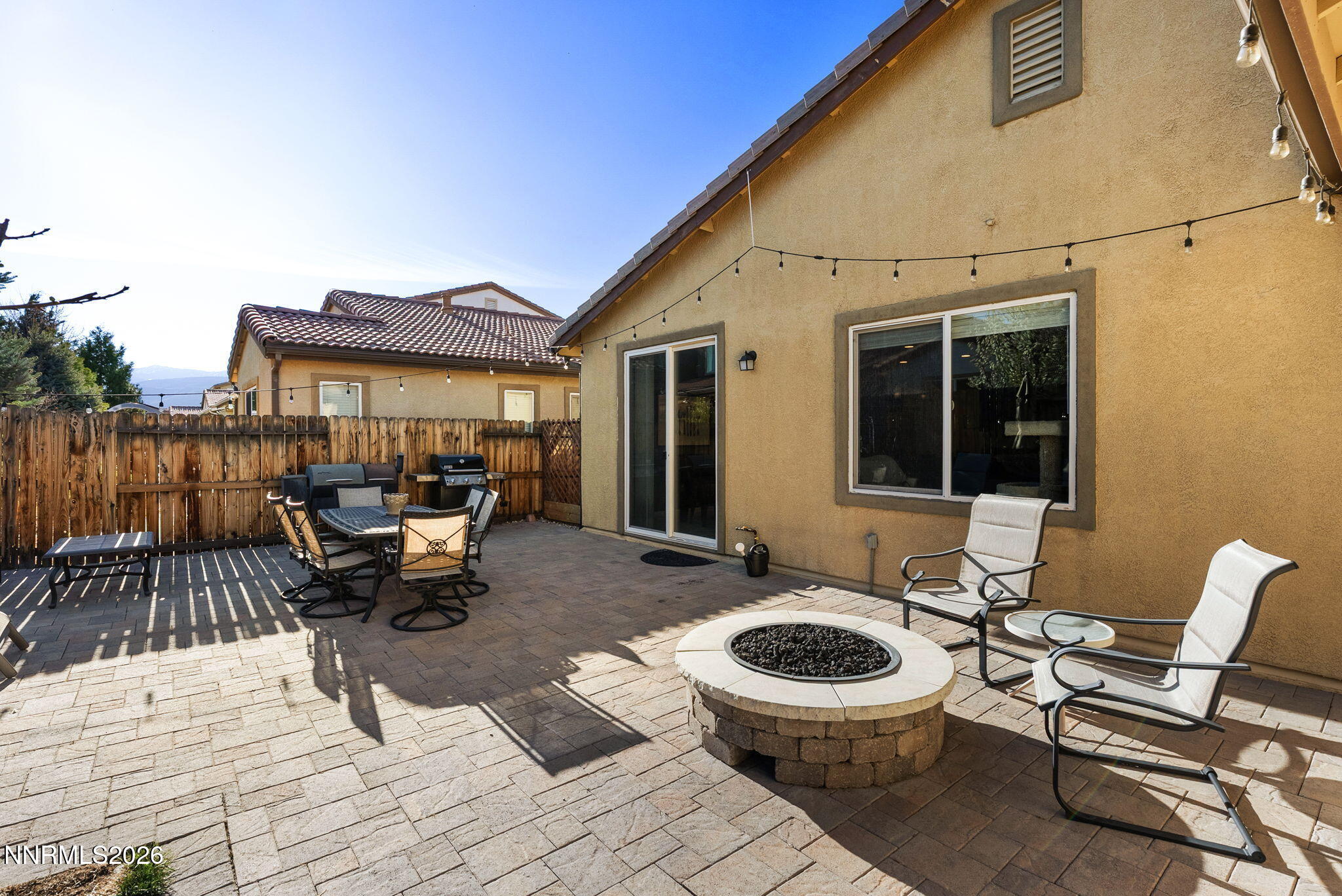 2190 Dutch Draft Drive Reno, NV 89521 - Photo 26 of 32 a view of a patio with couple of chairs and a barbeque