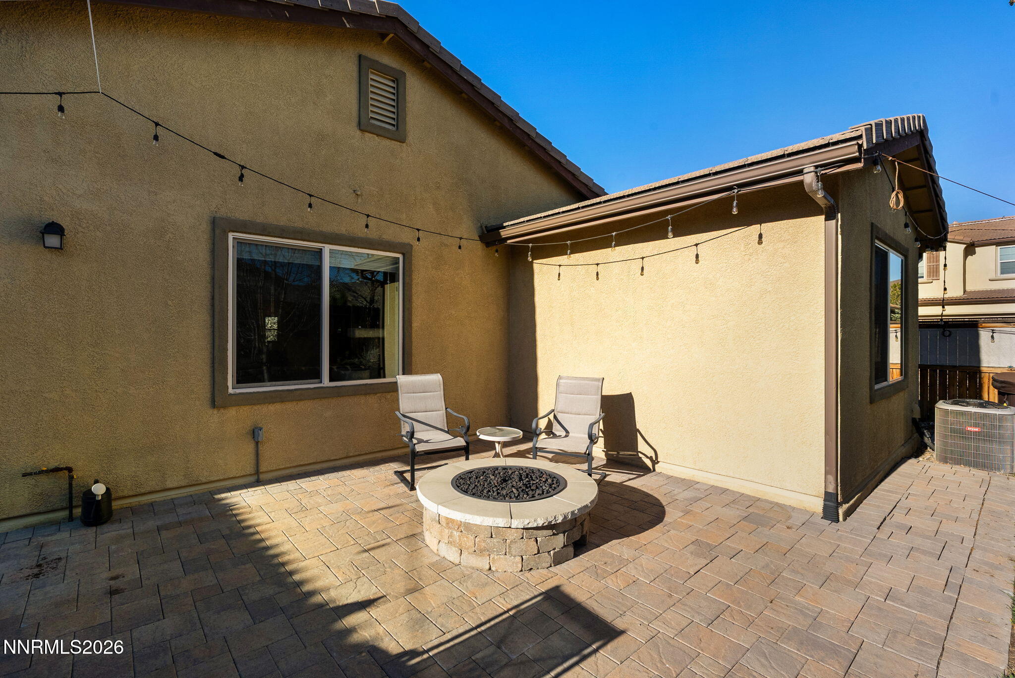 2190 Dutch Draft Drive Reno, NV 89521 - Photo 31 of 32 a backyard of a house with table and chairs