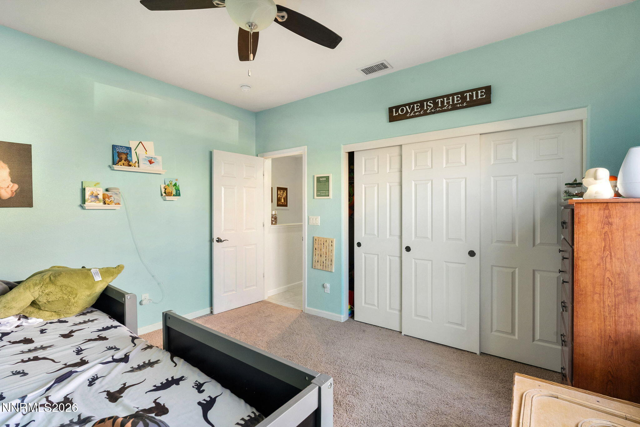 2190 Dutch Draft Drive Reno, NV 89521 - Photo 10 of 32 a bedroom with a bed and a dresser in it