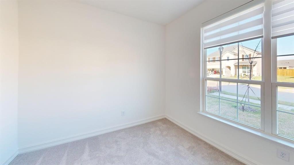 1616 Prosper Lane Anna, TX 75409 - Photo 11 of 24 Empty room featuring baseboards and light colored carpet