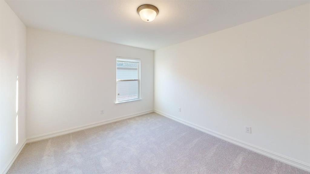 1616 Prosper Lane Anna, TX 75409 - Photo 12 of 24 Empty room with light carpet and baseboards