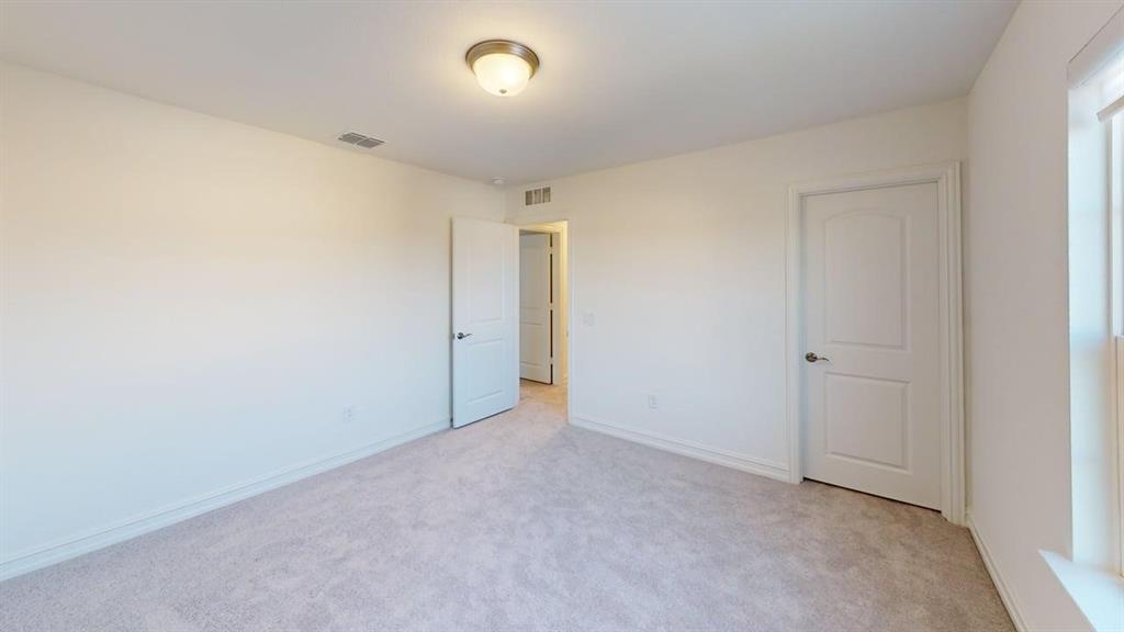 1616 Prosper Lane Anna, TX 75409 - Photo 14 of 24 Unfurnished bedroom with light carpet and baseboards