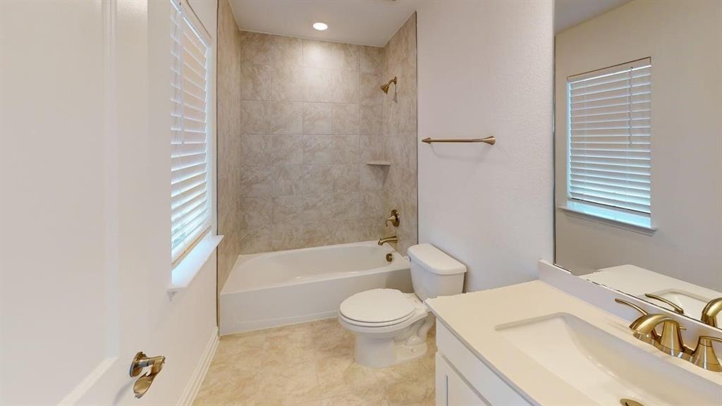 1616 Prosper Lane Anna, TX 75409 - Photo 20 of 24 Full bathroom with vanity, washtub / shower combination, recessed lighting, and plenty of natural light