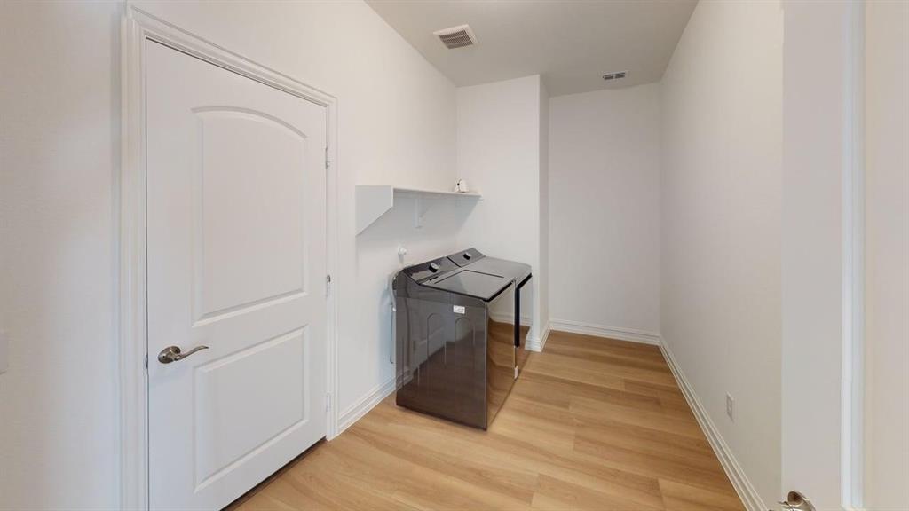 1616 Prosper Lane Anna, TX 75409 - Photo 23 of 24 Laundry room featuring light wood finished floors and washer and dryer