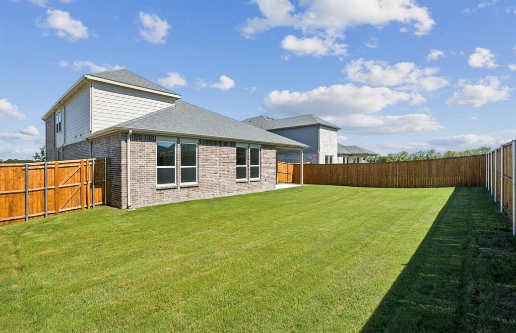 1616 Prosper Lane Anna, TX 75409 - Photo 24 of 24 Rear view of property featuring brick siding, a fenced backyard, a patio, and a shingled roof