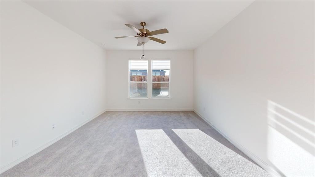 1616 Prosper Lane Anna, TX 75409 - Photo 7 of 24 Spare room featuring light carpet and a ceiling fan